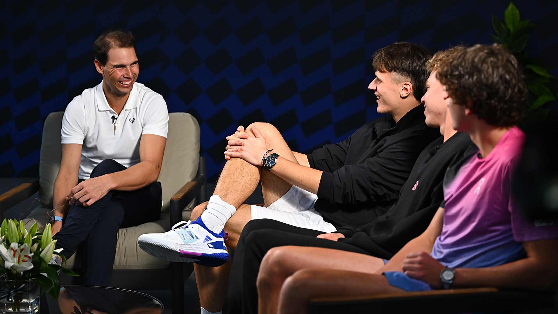 Rafael Nadal chats with Jakub Mensik, Alex Michelsen, and Joao Fonseca.